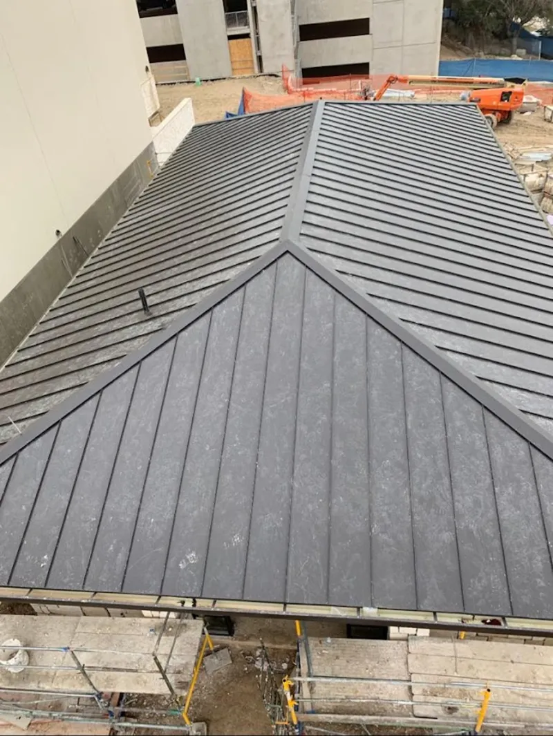 Commercial metal roof construction with crane equipment in Lincolnwood