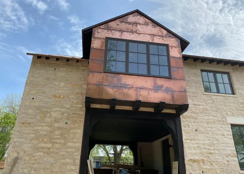 Copper metal panel facade on a stone building for Skylight Installation in Lincolnwood